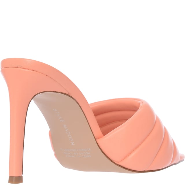 Upper: 100% Polyurethane, Lining: 100% Polyurethane, Sole: 100% Rubber. The Steve Madden Tempt heeled mules in peach are a stunning choice for anyone looking to add a touch of elegance and height to their outfit. With their sleek stiletto heel and easy slip-on design, these mules are not only stylish but also comfortable and versatile, making them perfect for both office wear and evening outings. The natural peach hue offers a subtle yet chic look that can complement a wide range of colors and styles in your wardrobe.