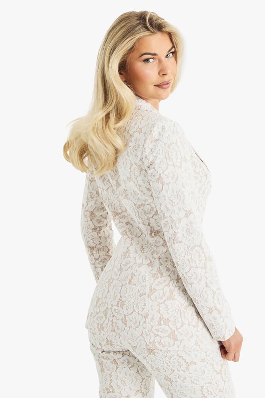 Exquisite lace detailing for a luxurious look
        Slim fit design for a sleek silhouette
        Single-button closure for a polished finish
        Collared neckline adds a touch of sophistication
        Versatile piece suitable for various formal occasions
    
    Make a lasting impression with this stunning lace blazer from Boohoo. Perfect for the fashion-forward woman who desires to stand out at any formal event. The intricate lace pattern adds a touch of romance and elegance, while the slim fit accentuates your figure beautifully. Style it with matching trousers for a coordinated suit look, or pair it with a sleek midi dress for a chic ensemble. Ideal for weddings, races, or graduations, this blazer offers endless styling possibilities. For a more relaxed yet refined look, team it with tailored trousers and a silk camisole. Add some delicate jewellery and strappy heels to complete your outfit. This versatile piece will quickly become a go-to in your wardrobe for those moments when you want to radiate confidence and sophistication.