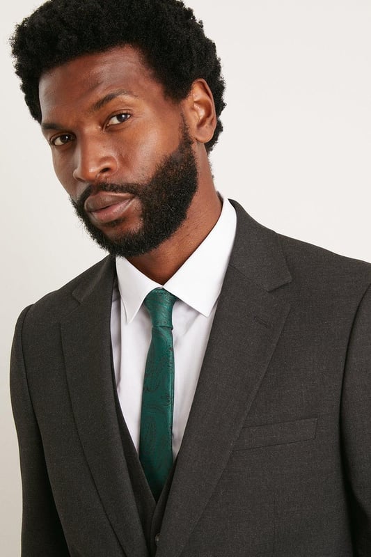 Introducing our Slim Fit Essential Smart Jacket, perfect for any occasion. The back vent allows for ease of movement and added comfort. Whether you're dressing up for a formal event or adding a touch of sophistication to your everyday look, our Slim Fit Essential Jacket is the perfect choice.