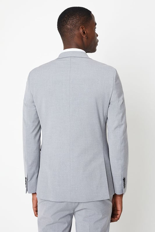 Introducing our Skinny Fit Essential Smart Jacket, perfect for any occasion. This jacket features a 2 button closure and a notch lapel, giving it a classic and timeless look. The twin back vent allows for ease of movement and added comfort. Made with a polyester viscose blend fabric with added stretch, to ensure a cool and comfortable fit all day long. Whether you're dressing up for a formal event or adding a touch of sophistication to your everyday look, our Skinny Fit Essential Smart Jacket is the perfect choice.