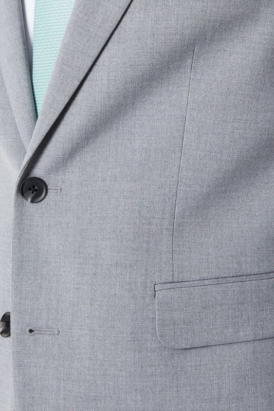 Introducing our Skinny Fit Essential Smart Jacket, perfect for any occasion. This jacket features a 2 button closure and a notch lapel, giving it a classic and timeless look. The twin back vent allows for ease of movement and added comfort. Made with a polyester viscose blend fabric with added stretch, to ensure a cool and comfortable fit all day long. Whether you're dressing up for a formal event or adding a touch of sophistication to your everyday look, our Skinny Fit Essential Smart Jacket is the perfect choice.