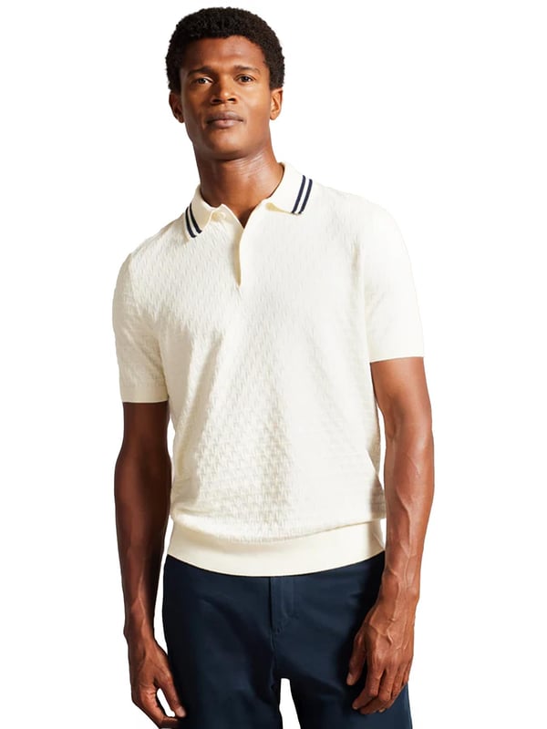 Elevate your everyday wardrobe with the MAHANA polo shirt, designed for effortless style and all-day comfort. Crafted from a premium wool blend, this polo offers a soft feel with a refined textured stitch for added sophistication. The classic button placket and short-sleeved design make it a versatile choice for both smart and casual occasions. Featuring a stylish striped collar, this polo blends traditional charm with modern detailing