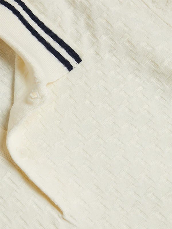 Elevate your everyday wardrobe with the MAHANA polo shirt, designed for effortless style and all-day comfort. Crafted from a premium wool blend, this polo offers a soft feel with a refined textured stitch for added sophistication. The classic button placket and short-sleeved design make it a versatile choice for both smart and casual occasions. Featuring a stylish striped collar, this polo blends traditional charm with modern detailing