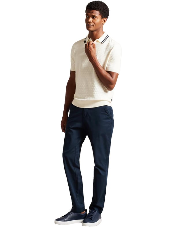 Elevate your everyday wardrobe with the MAHANA polo shirt, designed for effortless style and all-day comfort. Crafted from a premium wool blend, this polo offers a soft feel with a refined textured stitch for added sophistication. The classic button placket and short-sleeved design make it a versatile choice for both smart and casual occasions. Featuring a stylish striped collar, this polo blends traditional charm with modern detailing