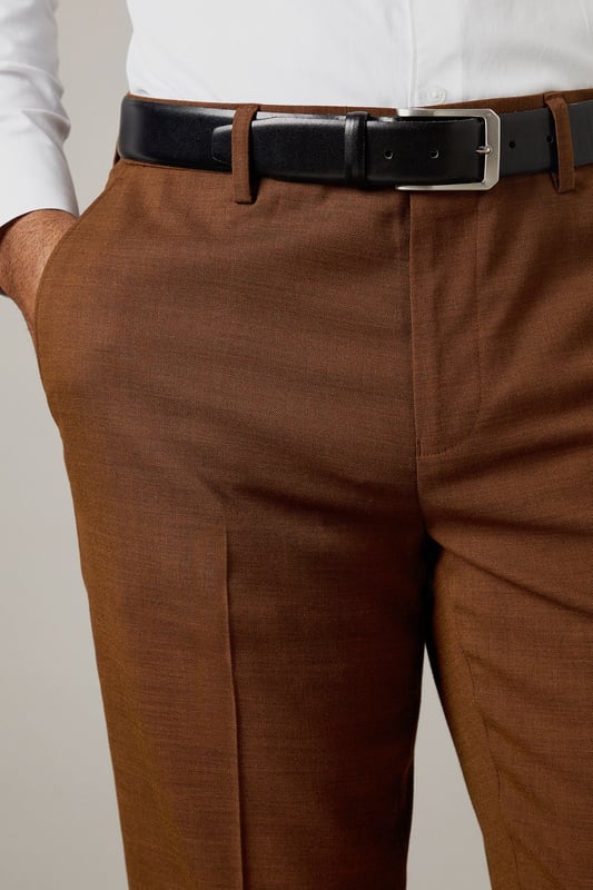 Slim fit design for a modern, tailored silhouette
        Versatile twill fabric with a subtle sheen
        Belt loops for accessorising
        Crisp centre creases for a polished look
        Rear welt pockets for a sleek finish
    
    These Burton slim fit suit trousers are the perfect foundation for your smart wardrobe. The tailored silhouette offers a contemporary edge while maintaining a classic appeal. Crafted from a twill fabric, they provide comfort and durability for all-day wear. Style these trousers with a crisp white shirt and polished Oxfords for a sophisticated office ensemble. For smart-casual events, pair them with a fine-knit jumper and leather trainers. The versatile design makes them suitable for various occasions, from important business meetings to after-work drinks with colleagues. Add a matching jacket for a complete suit look, or mix and match with other pieces to create unique outfits. These trousers are a staple for the modern gentleman who appreciates timeless style with a refined twist.