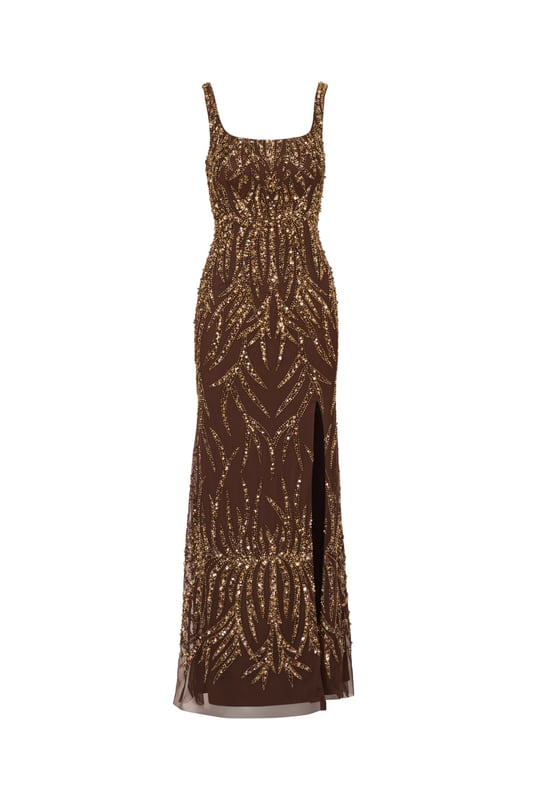 A sparkling night under the stars starts with this beaded mermaid gown. This formal dress features a square neckline, tank straps, a fitted silhouette, and a mermaid skirt. Crafted from mesh knit fabric and embellished throughout by figure-flattering sequin beaded designs, this evening gown is a showstopping look for formal wedding and black-tie events. A hidden zipper closure at the square centre back completes this elegant dress. Paired with metallic heels and crystal jewels, this black-tie dress will make a splash when you RSVP yes.