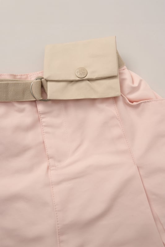 This 2-Piece outfit set from Fudo includes a stylish T-shirt with a large print, rolled sleeves, an elasticated hem, and a keyhole fastening. The matching skort is pleated, made from woven material, and features a detachable fabric belt with a purse. A chic and functional outfit for your little one!