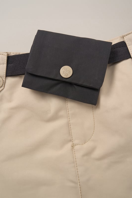 This 2-Piece outfit set from Fudo includes a stylish T-shirt with a large print, rolled sleeves, an elasticated hem, and a keyhole fastening. The matching skort is pleated, made from woven material, and features a detachable fabric belt with a purse. A chic and functional outfit for your little one!