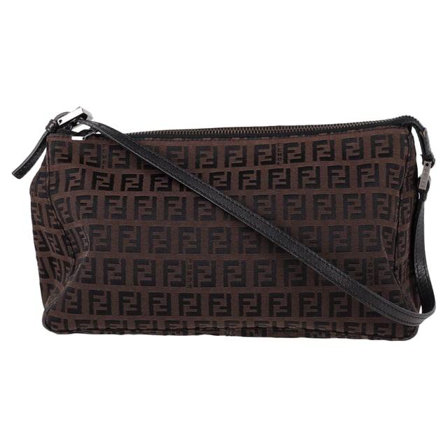 VINTAGE, RRP AS NEW
The Fendi Zucca FF Baguette Shoulder Bag in Brown Canvas is a bold and iconic accessory, featuring the signature FF monogram that gives it a timeless yet contemporary appeal. Crafted from durable canvas, this bag offers both style and functionality with its compact size and versatile shoulder strap. Pair it with a sleek black dress and heels for a sophisticated evening look, or wear it with jeans and a blazer for a chic, everyday ensemble. The warm brown tones of the canvas make it a versatile addition to any wardrobe, effortlessly complementing both casual and formal outfits.

 Fendi Zucca FF Baguette Shoulder Bag in Brown Canvas

Condition: Very good
Signs of wear: No retail tag, Minor sign of wear., Lightly used but very well maintained. Minor creasing, light worn corners, light scratches.
Packaging: Box
Color: Brown | ochre
Material: Canvas 
Size: One Size | One Size
Measurements: Width: 90; Height: 160; Length: 250; Handle drop: 200; Strap length: 470
SKU: NAPPUGBBA463283W