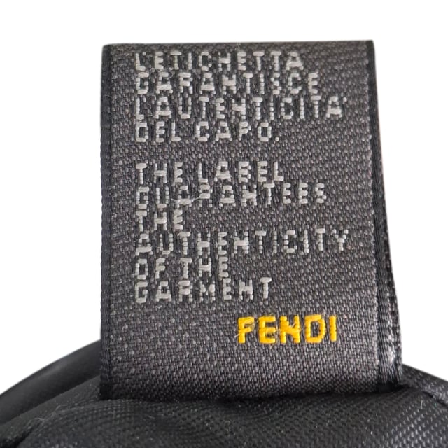 VINTAGE, RRP AS NEW
The Fendi Zucca FF Baguette Shoulder Bag in Brown Canvas is a bold and iconic accessory, featuring the signature FF monogram that gives it a timeless yet contemporary appeal. Crafted from durable canvas, this bag offers both style and functionality with its compact size and versatile shoulder strap. Pair it with a sleek black dress and heels for a sophisticated evening look, or wear it with jeans and a blazer for a chic, everyday ensemble. The warm brown tones of the canvas make it a versatile addition to any wardrobe, effortlessly complementing both casual and formal outfits.

 Fendi Zucca FF Baguette Shoulder Bag in Brown Canvas

Condition: Very good
Signs of wear: No retail tag, Minor sign of wear., Lightly used but very well maintained. Minor creasing, light worn corners, light scratches.
Packaging: Box
Color: Brown | ochre
Material: Canvas 
Size: One Size | One Size
Measurements: Width: 90; Height: 160; Length: 250; Handle drop: 200; Strap length: 470
SKU: NAPPUGBBA463283W