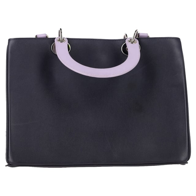 VINTAGE, RRP AS NEW
The Christian Dior Medium Diorissimo Tote Bag in Navy Blue and Silver Calf Leather is a luxurious and timeless accessory, crafted from premium calf leather with a sleek navy blue finish and subtle silver accents. Its spacious interior and structured design make it both practical and elegant, perfect for carrying all your essentials in style. Pair it with a tailored blazer and trousers for a polished, sophisticated look, or carry it with a casual outfit like a cozy sweater and jeans for an elevated everyday vibe. Add simple silver jewelry to complement the bag’s refined detailing and complete your chic ensemble.

Christian Dior Medium Diorissimo Tote Bag in Navy Blue and Silver Leather

Condition: Excellent
Signs of wear: No retail tag, No visible sign of wear., 
Packaging: Dust bag
Color: Blue | navy blue
Material: Leather | calfskin leather
Size: One Size | One Size
Measurements: Width: 120; Height: 230; Length: 310; Handle drop: 380; Strap length: 720
SKU: NAPPUGBBA463492W