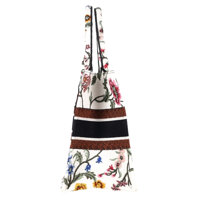 VINTAGE, RRP AS NEW
The Dior Embroidered Medium Rosa Mutabilis Book Tote in multicolor canvas is a vibrant and artistic addition to your accessory collection. Adorned with an intricate floral embroidery design, this tote captures the essence of Dior's commitment to both luxury and craftsmanship. The matching multicolor canvas rolled handles and the iconic CHRISTIAN DIOR logo embroidered across the front bring a refined yet playful touch. With a spacious fabric interior, this tote is as functional as it is stylish, offering plenty of room for your essentials while making a bold fashion statement.



with Dust bag

Dior Embroidered Medium Rosa Mutabilis Book Tote in Multicolor Canvas
Condition: Excellent
Signs of wear: No retail tag, No visible sign of wear., 
Packaging: Dust bag
Color: Multicolor | multicolor
Material: Canvas
Size: One Size | One Size
Measurements: Width: 160; Height: 270; Length: 360; Handle drop: 170; Strap length: 380
SKU: NAPPUGBBA463238W