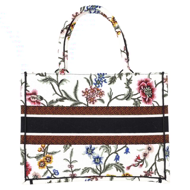 VINTAGE, RRP AS NEW
The Dior Embroidered Medium Rosa Mutabilis Book Tote in multicolor canvas is a vibrant and artistic addition to your accessory collection. Adorned with an intricate floral embroidery design, this tote captures the essence of Dior's commitment to both luxury and craftsmanship. The matching multicolor canvas rolled handles and the iconic CHRISTIAN DIOR logo embroidered across the front bring a refined yet playful touch. With a spacious fabric interior, this tote is as functional as it is stylish, offering plenty of room for your essentials while making a bold fashion statement.



with Dust bag

Dior Embroidered Medium Rosa Mutabilis Book Tote in Multicolor Canvas
Condition: Excellent
Signs of wear: No retail tag, No visible sign of wear., 
Packaging: Dust bag
Color: Multicolor | multicolor
Material: Canvas
Size: One Size | One Size
Measurements: Width: 160; Height: 270; Length: 360; Handle drop: 170; Strap length: 380
SKU: NAPPUGBBA463238W
