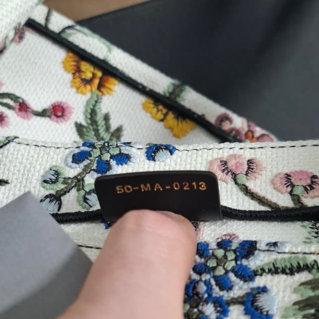 VINTAGE, RRP AS NEW
The Dior Embroidered Medium Rosa Mutabilis Book Tote in multicolor canvas is a vibrant and artistic addition to your accessory collection. Adorned with an intricate floral embroidery design, this tote captures the essence of Dior's commitment to both luxury and craftsmanship. The matching multicolor canvas rolled handles and the iconic CHRISTIAN DIOR logo embroidered across the front bring a refined yet playful touch. With a spacious fabric interior, this tote is as functional as it is stylish, offering plenty of room for your essentials while making a bold fashion statement.



with Dust bag

Dior Embroidered Medium Rosa Mutabilis Book Tote in Multicolor Canvas
Condition: Excellent
Signs of wear: No retail tag, No visible sign of wear., 
Packaging: Dust bag
Color: Multicolor | multicolor
Material: Canvas
Size: One Size | One Size
Measurements: Width: 160; Height: 270; Length: 360; Handle drop: 170; Strap length: 380
SKU: NAPPUGBBA463238W