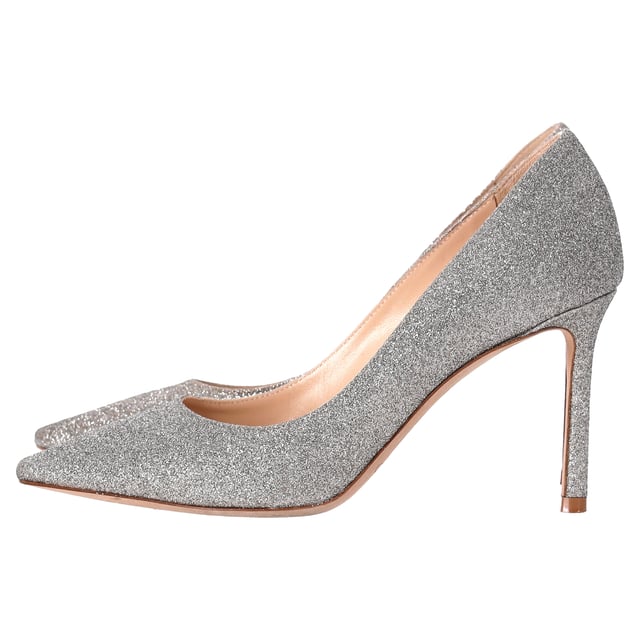 VINTAGE, RRP AS NEW
Step into elegance and sparkle with the Jimmy Choo Romy Pumps in silver glitter. These stunning heels feature a shimmering silver-tone glitter design that catches the light with every step. The 85mm stiletto heel offers just the right amount of height, while the pointed toe enhances the sleek, sophisticated silhouette. Finished with a branded leather insole and leather sole, these pumps are a perfect blend of comfort and luxury.

 Includes Box

Jimmy Choo Romy Pumps in Silver Glitter
Condition: very good
Signs of wear: Include Box., No visible sign of wear. No Mark at insole., Used but well maintained. Moderate creasing and marks at surface, wear at soles or replaced soles.
Packaging: Box
Color: silver
Material: Glitter | glitter
Size: EU | 35
Measurements: Heel height: 80; Insole length: 230
SKU: TONPUDESH462815W