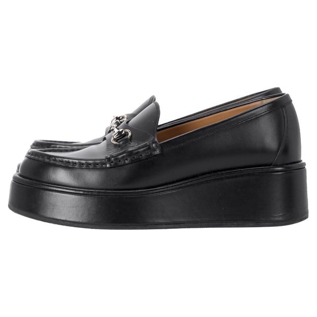 VINTAGE, RRP AS NEW
The Gucci Horsebit Wedge Loafers in Black Leather combine the iconic Horsebit detail with a sleek, modern wedge design for a sophisticated yet comfortable shoe. Crafted from high-quality black leather, they offer both durability and timeless elegance, making them a versatile addition to any wardrobe. Pair them with tailored trousers or a midi skirt to create a polished, office-ready look. For a more casual vibe, style them with cropped jeans and a crisp button-down shirt for a chic, everyday ensemble.

 Gucci Horsebit Wedge Loafers in Black Leather

Condition: Very good
Signs of wear: Include Box., No visible sign of wear. No Mark at insole., Lightly used but very well maintained. Minor mark at soles & creasing, light scuffing at the soles and heels.
Packaging: None
Color: Black
Material: Leather | leather
Size: IT | 36
Measurements: Heel height: 5; Insole length: 220
SKU: NAPPUITSH462835W