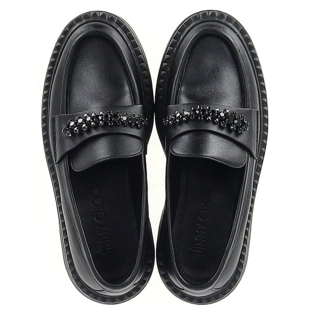 VINTAGE, RRP AS NEW
Step into refined luxury with the Jimmy Choo Bryer Flat Loafers in Black Leather. Crafted from buffed calfskin, these loafers offer a perfect blend of comfort and style. The round moc toe adds a classic touch, while the crystal-cut hardware at the vamp delivers a hint of sparkle and sophistication. The buffed calfskin lining ensures a smooth, luxurious feel, while the textured rubber platform midsole and treaded rubber outsole provide durability and traction. With a platform height of 1.75 inches, these loafers give you subtle lift without sacrificing comfort, making them ideal for both casual and more elevated looks.
with Dust bag

Jimmy Choo Bryer Flat Loafers in Black Leather
Condition: Excellent
Signs of wear: No visible sign of wear. No Mark at insole.,  Very light mark at soles.
Packaging: Dust bag
Color: black
Material: Leather | leather
Size: EU | 37
Measurements: Insole length: 280
SKU: NAPPUGBSH462131W