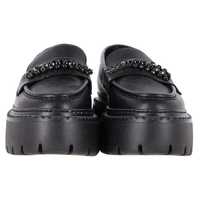VINTAGE, RRP AS NEW
Step into refined luxury with the Jimmy Choo Bryer Flat Loafers in Black Leather. Crafted from buffed calfskin, these loafers offer a perfect blend of comfort and style. The round moc toe adds a classic touch, while the crystal-cut hardware at the vamp delivers a hint of sparkle and sophistication. The buffed calfskin lining ensures a smooth, luxurious feel, while the textured rubber platform midsole and treaded rubber outsole provide durability and traction. With a platform height of 1.75 inches, these loafers give you subtle lift without sacrificing comfort, making them ideal for both casual and more elevated looks.
with Dust bag

Jimmy Choo Bryer Flat Loafers in Black Leather
Condition: Excellent
Signs of wear: No visible sign of wear. No Mark at insole.,  Very light mark at soles.
Packaging: Dust bag
Color: black
Material: Leather | leather
Size: EU | 37
Measurements: Insole length: 280
SKU: NAPPUGBSH462131W