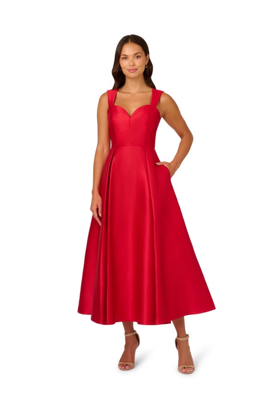 Classic elegance in a garment, this ankle-length sleeveless dress is constructed in crisp and lustrous Mikado fabric. Tailored details harken back to 50s couture with a sweetheart neckline and fit and flare silhouette. The back features a wide cutout at the top for a modern touch. A back zipper and side pockets finish the look.