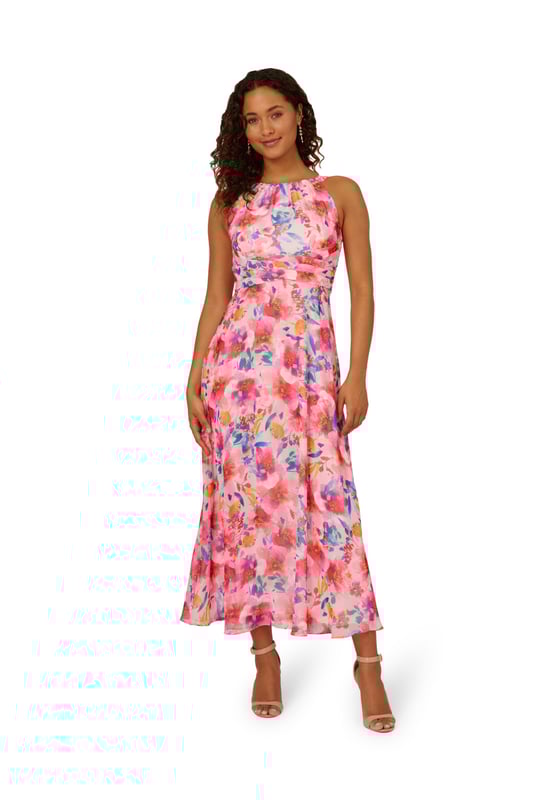 Bright and bold, this halter gown is a hit for every event. This formal dress features a halter bodice with shirred details, a soft skirt, and a self-tie waist. Crafted from floral printed chiffon fabric, this ankle-length dress has minimal stretch. A hidden zipper closure at the centre back of this dress completes the design. A pretty look for formal parties and black-tie weddings, this floral gown is a head-turner.