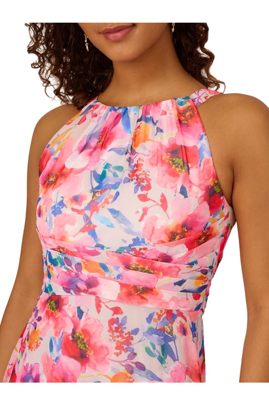 Bright and bold, this halter gown is a hit for every event. This formal dress features a halter bodice with shirred details, a soft skirt, and a self-tie waist. Crafted from floral printed chiffon fabric, this ankle-length dress has minimal stretch. A hidden zipper closure at the centre back of this dress completes the design. A pretty look for formal parties and black-tie weddings, this floral gown is a head-turner.