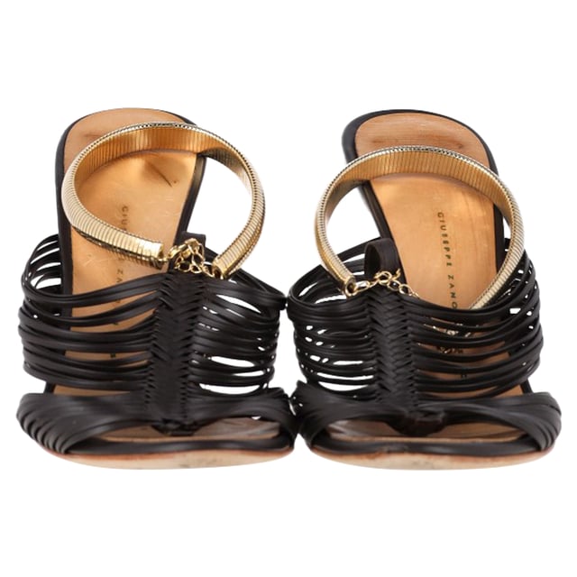 VINTAGE, RRP AS NEW
 Step into elegance with the Giuseppe Zanotti Strappy Sandals in Black Leather. Expertly crafted from dark leather, these sandals feature multiple slender straps that beautifully wrap around the foot, accented with gold-tone details that exude subtle glamour. The 10 cm heels provide just the right amount of lift, enhancing your silhouette while maintaining comfort and stability with sturdy soles. Perfect for a night out or a special occasion, these sandals offer a refined, sophisticated look that pairs well with a variety of outfits.with Dust bag

Giuseppe Zanotti Strappy Sandals in Black Leather
Condition: good
Signs of wear: Minor markings, Lightly used but very well maintained. Minor mark at soles & creasing, light scuffing at the soles and heels.
Packaging: Dust bag
Color: Black
Material: Leather | leather
Size: EU | 37
Measurements: Heel height: 90; Insole length: 240
SKU: NAPPUGBSH462133W