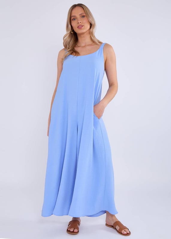 Elevate your style with our Blue Air Flow Strappy Wide Leg Jumpsuit. Made with lightweight, breathable fabric, this jumpsuit features a flattering strappy design and wide legs for a chic and comfortable fit. Perfect for special occasions or any stylish outing.