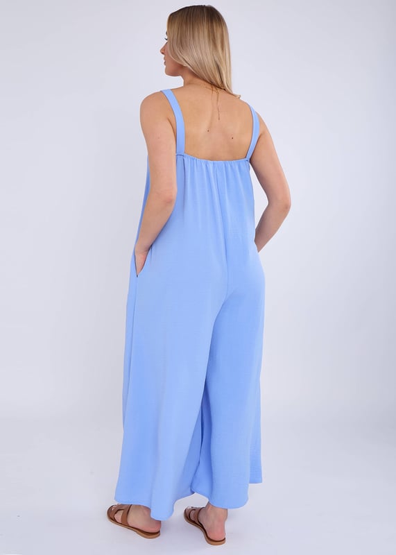 Elevate your style with our Blue Air Flow Strappy Wide Leg Jumpsuit. Made with lightweight, breathable fabric, this jumpsuit features a flattering strappy design and wide legs for a chic and comfortable fit. Perfect for special occasions or any stylish outing.