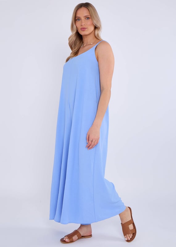 Elevate your style with our Blue Air Flow Strappy Wide Leg Jumpsuit. Made with lightweight, breathable fabric, this jumpsuit features a flattering strappy design and wide legs for a chic and comfortable fit. Perfect for special occasions or any stylish outing.