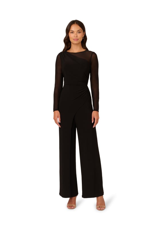 Mesh details add depth and texture to this monochrome wide leg long sleeve jumpsuit. The zip-back bodice features a one-shoulder stretch jersey design with mesh sleeves and shoulders creating a unique asymmetrical illusion neckline. Matching stretch jersey trousers in a wide cut complete this sleek and sophisticated all-in-one ensemble.