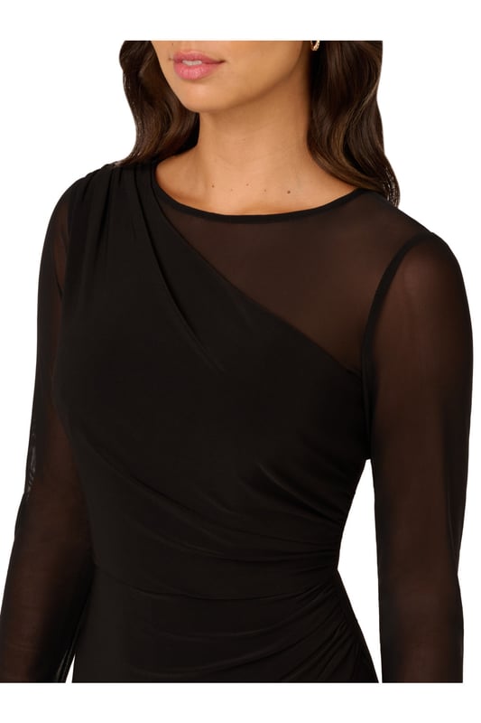 Mesh details add depth and texture to this monochrome wide leg long sleeve jumpsuit. The zip-back bodice features a one-shoulder stretch jersey design with mesh sleeves and shoulders creating a unique asymmetrical illusion neckline. Matching stretch jersey trousers in a wide cut complete this sleek and sophisticated all-in-one ensemble.