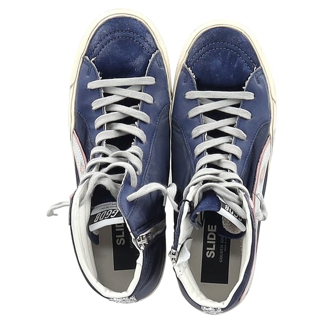 VINTAGE, RRP AS NEW
The Golden Goose Slide High-Top Sneakers in navy blue suede and leather combine luxury with laid-back style, featuring a distressed, vintage-inspired look that adds effortless cool to any outfit. Crafted with premium materials, these sneakers offer both comfort and durability, while the high-top design provides extra support and style. Pair them with skinny jeans or a casual dress for a chic, street-style look, or wear them with leggings for a sporty vibe. Add a leather jacket and minimalist accessories to complete the edgy, fashion-forward ensemble.

 Golden Goose Slide High-Top Sneakers in Navy Blue Suede and Leather

Condition: Excellent
Signs of wear: Include Box., No visible sign of wear. No Mark at insole.,  Very light mark at soles.
Packaging: Box, Dust bag
Color: Blue | navy blue
Material: Suede
Size: EU | 42
Measurements: Heel height: 120; Insole length: 280
SKU: NAPPUGBSH463289W