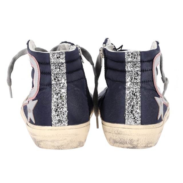 VINTAGE, RRP AS NEW
The Golden Goose Slide High-Top Sneakers in navy blue suede and leather combine luxury with laid-back style, featuring a distressed, vintage-inspired look that adds effortless cool to any outfit. Crafted with premium materials, these sneakers offer both comfort and durability, while the high-top design provides extra support and style. Pair them with skinny jeans or a casual dress for a chic, street-style look, or wear them with leggings for a sporty vibe. Add a leather jacket and minimalist accessories to complete the edgy, fashion-forward ensemble.

 Golden Goose Slide High-Top Sneakers in Navy Blue Suede and Leather

Condition: Excellent
Signs of wear: Include Box., No visible sign of wear. No Mark at insole.,  Very light mark at soles.
Packaging: Box, Dust bag
Color: Blue | navy blue
Material: Suede
Size: EU | 42
Measurements: Heel height: 120; Insole length: 280
SKU: NAPPUGBSH463289W
