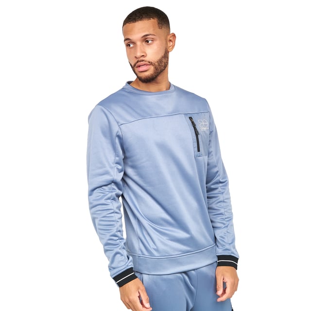 Materiaal: Polyester. Stof: Tricot. Ontwerp: Contrasterende details, Logo. Zakken: Ripstop zak, patch, omgekeerde spiraalrits. Hals: Crew Neck. Hem: Aangepast. Manchet: Gemonteerd. Mouwtype: Met lange mouwen. Nekband achteraan, zelfklevend.