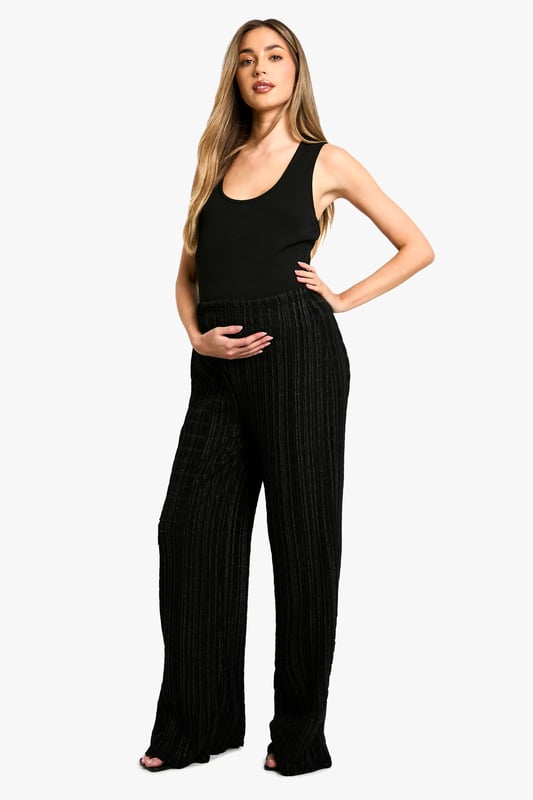 Textured wide-leg trousers with a crinkle effect
        Comfortable jersey fabric for all-day wear
        Drawstring waist for adjustable fit
        Relaxed silhouette perfect for maternity wear
        Versatile design suitable for various casual occasions
    
    Embrace comfort and style during your pregnancy with these textured wide-leg trousers from Boohoo. The crinkle effect adds a touch of interest to the relaxed silhouette, while the jersey fabric ensures all-day comfort as your body changes. The drawstring waist allows for easy adjustment, accommodating your growing bump with ease. Style these trousers with a fitted tank top and a lightweight blazer for a polished yet comfortable look perfect for family gatherings or casual outings. For a more laid-back ensemble, pair with a loose-fitting tee and trainers. The versatile design of these trousers makes them a wardrobe staple that can be dressed up or down to suit various casual occasions throughout your pregnancy and beyond.