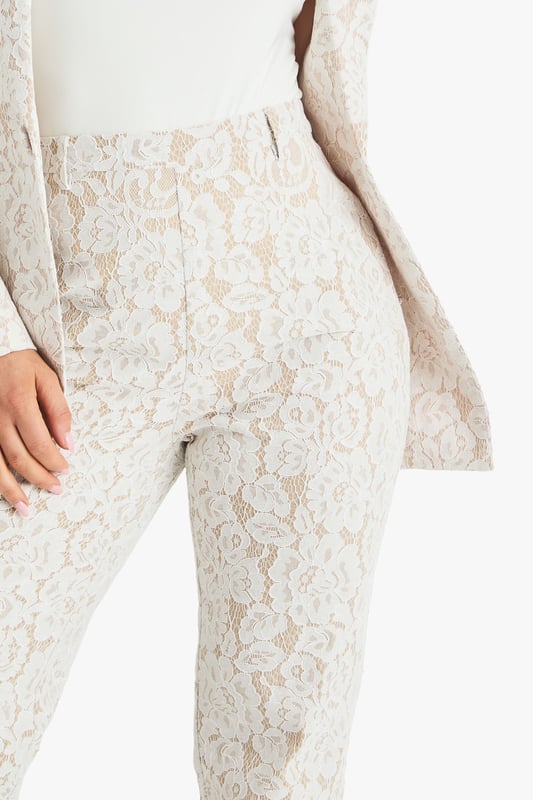 Exquisite lace flared trousers with matching blazer
        High-waisted design for a flattering silhouette
        Elegant woven crepe fabric with intricate lace pattern
        Flared leg cut for a dramatic, fashion-forward look
        Versatile two-piece set suitable for various formal occasions
    
    Make a lasting impression with these stunning lace flared trousers from Boohoo. Perfect for the fashion-forward woman who loves to stand out, these trousers offer a bold and sophisticated look for any special event. The high-waisted design accentuates your curves, while the flared leg creates a dramatic silhouette that's sure to turn heads. Pair with the matching blazer for a coordinated ensemble that exudes confidence and style. Ideal for weddings, formal parties, or glamorous nights out, these trousers can be dressed up or down to suit your needs. For a chic daytime look, style with a simple camisole and strappy heels. For evening events, amp up the glamour with statement jewellery and a sleek clutch. The versatility of this piece ensures it will become a go-to in your wardrobe for seasons to come.