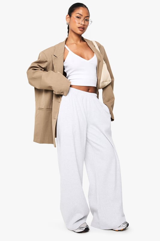 Ribbed texture adds subtle dimension and visual interest to these straight-leg trousers
        High-rise waistband with comfortable stretch for all-day wear
        Relaxed straight-leg silhouette offers effortless movement
        Versatile design perfect for mixing and matching with your wardrobe staples
        Soft fabric blend provides comfort without compromising on style
    
    These Boohoo Basics ribbed straight-leg trousers are the foundation of countless stylish looks. The relaxed fit creates a laid-back silhouette that works brilliantly with cropped tops for a balanced proportion, as shown by our model. Style with trainers for daytime casual outings or dress up with a structured blazer for smart-casual settings. The ribbed texture adds a contemporary touch to these otherwise minimalist trousers, making them ideal for family gatherings or weekend brunches. For cooler days, layer with an oversized jumper or cardigan for a cosy yet put-together ensemble. These trousers offer the perfect combination of comfort and style, making them an essential addition to your casual wardrobe rotation.