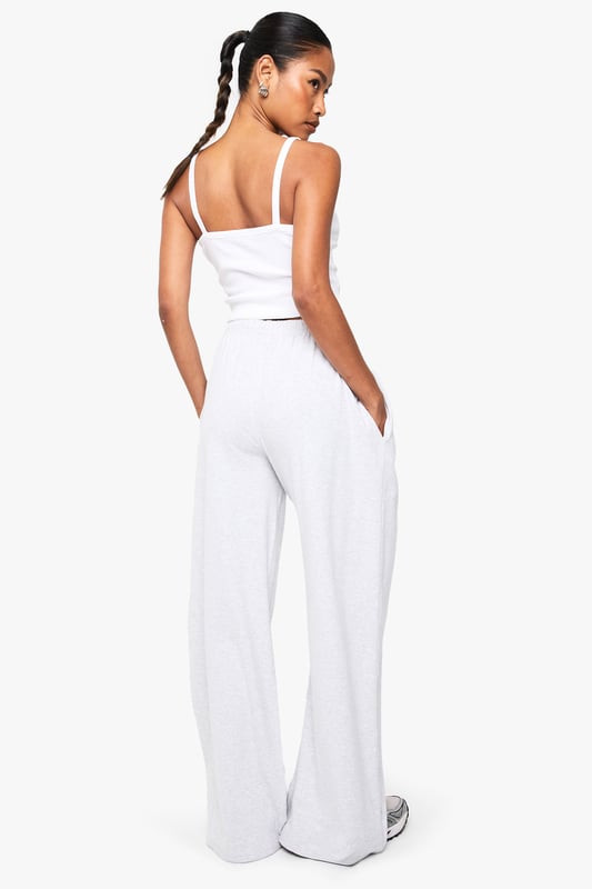 Ribbed texture adds subtle dimension and visual interest to these straight-leg trousers
        High-rise waistband with comfortable stretch for all-day wear
        Relaxed straight-leg silhouette offers effortless movement
        Versatile design perfect for mixing and matching with your wardrobe staples
        Soft fabric blend provides comfort without compromising on style
    
    These Boohoo Basics ribbed straight-leg trousers are the foundation of countless stylish looks. The relaxed fit creates a laid-back silhouette that works brilliantly with cropped tops for a balanced proportion, as shown by our model. Style with trainers for daytime casual outings or dress up with a structured blazer for smart-casual settings. The ribbed texture adds a contemporary touch to these otherwise minimalist trousers, making them ideal for family gatherings or weekend brunches. For cooler days, layer with an oversized jumper or cardigan for a cosy yet put-together ensemble. These trousers offer the perfect combination of comfort and style, making them an essential addition to your casual wardrobe rotation.