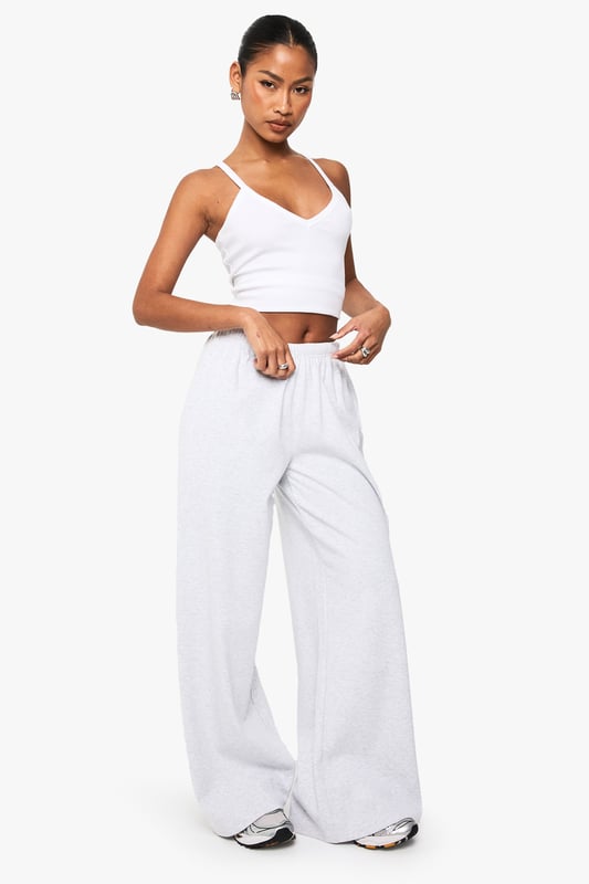 Ribbed texture adds subtle dimension and visual interest to these straight-leg trousers
        High-rise waistband with comfortable stretch for all-day wear
        Relaxed straight-leg silhouette offers effortless movement
        Versatile design perfect for mixing and matching with your wardrobe staples
        Soft fabric blend provides comfort without compromising on style
    
    These Boohoo Basics ribbed straight-leg trousers are the foundation of countless stylish looks. The relaxed fit creates a laid-back silhouette that works brilliantly with cropped tops for a balanced proportion, as shown by our model. Style with trainers for daytime casual outings or dress up with a structured blazer for smart-casual settings. The ribbed texture adds a contemporary touch to these otherwise minimalist trousers, making them ideal for family gatherings or weekend brunches. For cooler days, layer with an oversized jumper or cardigan for a cosy yet put-together ensemble. These trousers offer the perfect combination of comfort and style, making them an essential addition to your casual wardrobe rotation.
