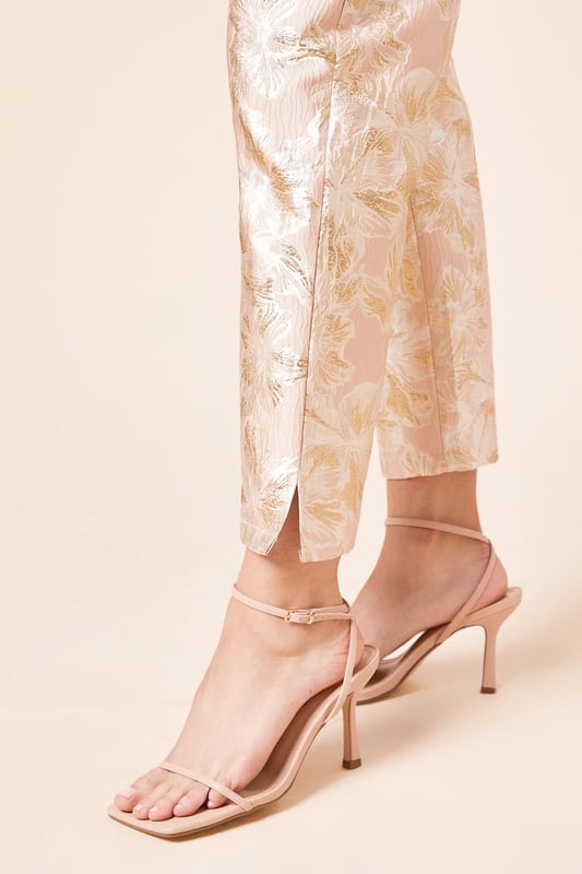 Elegant jacquard fabric with a lustrous finish and textured floral pattern
        Sophisticated tapered fit that narrows towards the ankle for a refined silhouette
        Practical side pockets for essential items
        Flattering high-waist design with a sleek waistband
        Ankle-length cut with subtle side slits for enhanced movement and style
    
    These Dorothy Perkins Tailored Jacquard Tapered Trousers offer the perfect balance of sophistication and contemporary style. The exquisite jacquard weave creates a textured finish that catches the light beautifully, making these trousers ideal for special occasions. Style with a crisp white blouse and strappy heels as shown for elegant wedding guest attire, or pair with a coordinating jacquard blazer for a striking head-to-toe look at formal events. The tapered silhouette creates a flattering shape that works wonderfully for race day ensembles or graduation ceremonies. For evening affairs, match with a simple camisole and statement jewellery to let the trousers take centre stage. These versatile occasion trousers transition seamlessly from day to night, offering endless styling possibilities for the fashion-conscious woman who appreciates refined elegance with a contemporary twist.