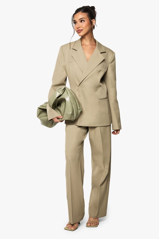 Tailored straight leg trousers with a textured woven finish for added dimension
        Flattering high-waist design with front pleats for a sophisticated silhouette
        Clean, straight-leg cut that creates a lengthening effect on the legs
        Versatile design that transitions seamlessly from office to evening occasions
        Subtle stretch in the fabric allows for comfortable movement throughout the day
    
    Make a bold statement with these tailored straight leg trousers from Boohoo. The textured woven crepe fabric adds subtle interest while maintaining a sleek appearance perfect for contemporary styling. Pair with the matching oversized blazer for a coordinated power suit that commands attention at your next night out, or style with a fitted bodysuit and strappy heels for a chic evening look. The high-waisted design with front pleats creates a flattering shape that works brilliantly with both cropped tops and tucked-in blouses. These trousers offer the perfect balance of structure and comfort, making them ideal for dancing the night away or enjoying drinks with friends. The straight leg cut provides a timeless silhouette that will remain a wardrobe staple for seasons to come, easily dressed up with statement jewellery or pared back with minimalist accessories.