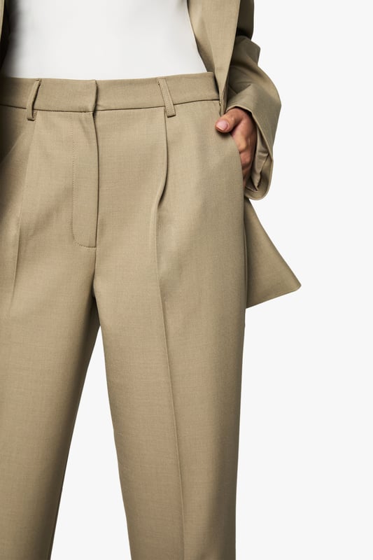 Tailored straight leg trousers with a textured woven finish for added dimension
        Flattering high-waist design with front pleats for a sophisticated silhouette
        Clean, straight-leg cut that creates a lengthening effect on the legs
        Versatile design that transitions seamlessly from office to evening occasions
        Subtle stretch in the fabric allows for comfortable movement throughout the day
    
    Make a bold statement with these tailored straight leg trousers from Boohoo. The textured woven crepe fabric adds subtle interest while maintaining a sleek appearance perfect for contemporary styling. Pair with the matching oversized blazer for a coordinated power suit that commands attention at your next night out, or style with a fitted bodysuit and strappy heels for a chic evening look. The high-waisted design with front pleats creates a flattering shape that works brilliantly with both cropped tops and tucked-in blouses. These trousers offer the perfect balance of structure and comfort, making them ideal for dancing the night away or enjoying drinks with friends. The straight leg cut provides a timeless silhouette that will remain a wardrobe staple for seasons to come, easily dressed up with statement jewellery or pared back with minimalist accessories.