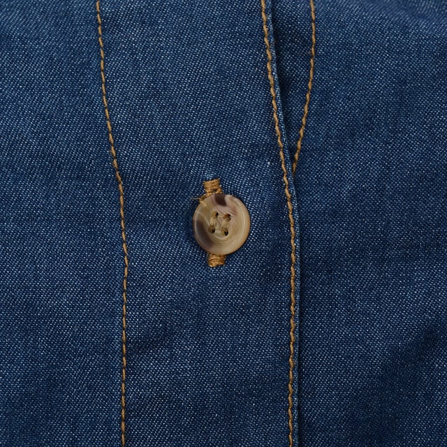 Main:Cotton. Collared shirt with long sleeves. Featuring front patch pockets with flaps and a button-up front.