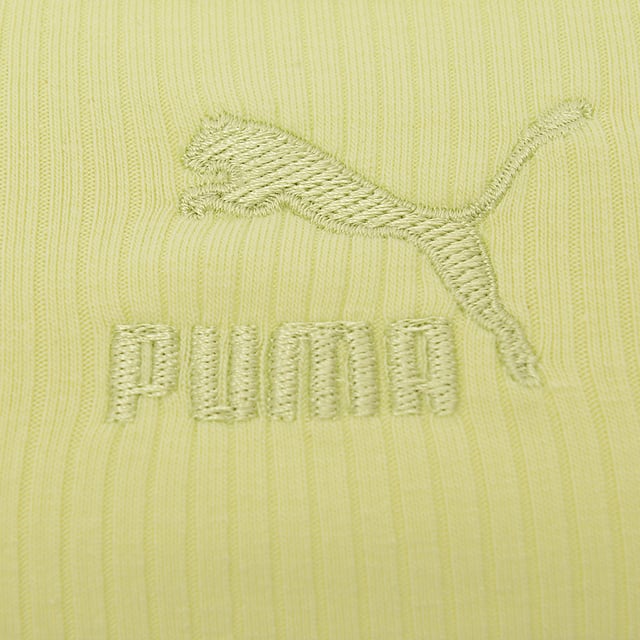 Main: 39% Polyester, Main: 58% Cotton, Main: 3% Elastane. The Puma Classics ribbed bralette in lime green is a vibrant and stylish choice for anyone looking to add a pop of color to their wardrobe. Its thick straps offer ample support, while the scooped back design adds a touch of elegance, making it perfect for both athletic activities and casual wear. This piece not only stands out for its bold hue but also for its comfort and versatility, embodying the essence of Puma's commitment to combining fashion with function.