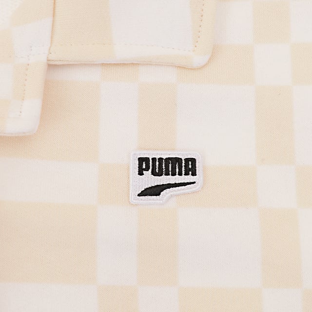 Main: 100% Cotton. The Puma Downtown checkerboard shirt is a stylish and versatile piece that combines a classic beige and white pattern with the subtle flair of small Puma branding. Its design features a smart collar and practical button fasteners, making it a perfect choice for both casual and semi-formal occasions. Whether you're heading to the office or out for a weekend event, this shirt promises to keep you looking sharp and feeling comfortable.
