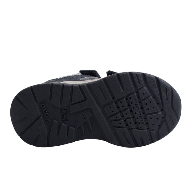Die Kinder-Sneaker Geox vereinen modernes Design und Komfort, um die Kleinen bei ihren täglichen Abenteuern zu begleiten. Mit sportlichem Stil und attraktiven Farben bieten diese Jungen-Sneaker einen vielseitigen und funktionalen Look.

 Details:
 - Atmungsaktiv.
 - Verschlussart: Doppelter Klettverschluss.
 - Rutschfeste Sohle.
 - Die perforierte Sohle ermöglicht den Füßen eine natürliche Atmung.
 - Antibakterielle Innensohle.
 - Flexy-System.
 - Geox Breathe: Technologie, die für eine bestmögliche Luftzirkulation sorgt und den Körper auf optimaler Temperatur hält. Das System bietet maximalen Komfort durch Atmungsaktivität und ein hohes Maß an Temperaturregulierung.

 Die Kinder-Sneaker Geox sind die perfekte Kombination aus Style, Komfort und Funktionalität. Sein sportliches Design mit Klettverschluss ermöglicht ein bequemes Tragen im Alltag, während die atmungsaktive Geox-Technologie Ihre Füße kühl und bequem hält.
 Komposition: Außen: Öko-Leder, Textil; Innenausstattung: Textil; Sohle: Gummi; Vorlage: Textil
 Pflege:
Verwenden Sie ein feuchtes Tuch oder eine weiche Bürste.
 Nicht in der Maschine waschen.
 Lassen Sie es an der Luft trocknen, ohne direkte Sonneneinstrahlung oder Hitze.