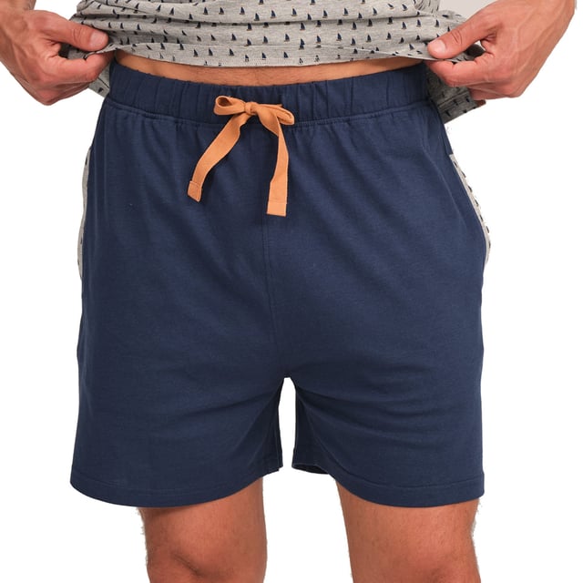 Enjoy a restful night's sleep in this stylish and comfortable men's pyjama set. Designed to provide maximum comfort without compromising on style, this men's pyjama set combines a short-sleeved T-shirt with shorts, perfect for lazy nights and relaxing at home.

 Details:

 T-shirt:
 - Relaxed fit.
 - V-neck.
 - Short sleeve.
 - Lightweight and breathable fabric.

 Short:
 - Short and baggy.
 - Side pockets.
 - Adjustable elastic waistband with drawstring.
 - Light and cool fabric for the warmest nights.
 - Tone-on-tone visible seams.

 For those seeking a restful night's sleep, J and J Brothers's luxurious short sleeve pyjama sets are just the ticket. Crafted from the finest fabrics and with an attention to detail unmatched in the industry, these comfortable and stylish men's short sleeve pyjamas will ensure you get a luxurious night's sleep each and every night.
 Composition: T-shirt: 100% Cotton; Shorts: 90% Cotton, 100% Cotton
 Care:
Machine wash max. 30ºC.
 Use mild detergent.
 Avoid bleaches.
 Dry at low temperature.
 Iron at low temperature.