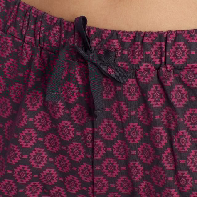 Summer pajamas from the Kisses&Love brand.
 Women's pajamas with short-sleeved T-shirt and shorts.
 The T-shirt features a round neck and armholes in a contrasting colour and a print in the centre. The print matches the shorts perfectly.
 The t-shirt is made of cotton, a perfect fabric for summer nights because it is breathable, soft and gentle on the skin.
 Elastic waistband.
 Brand logo on the t-shirt print and on the label.
 Tone-on-tone visible seams.

 Women's summer pajamas are the perfect garment to enjoy warm nights in style and comfort. These women's pajamas, designed specifically for the spring-summer season, combine lightness, softness and an elegant design that ensures freshness and comfort during rest hours.

 Choose style, quality and comfort with Kisses&Love!
 Composition: 100% Cotton
 Care:
Washing machine safe at maximum temperature of 30º.
 It does not resist bleach or any other chlorate.
 It does not resist ironing.
 Does not withstand dry cleaning.
 It does not resist the dryer.