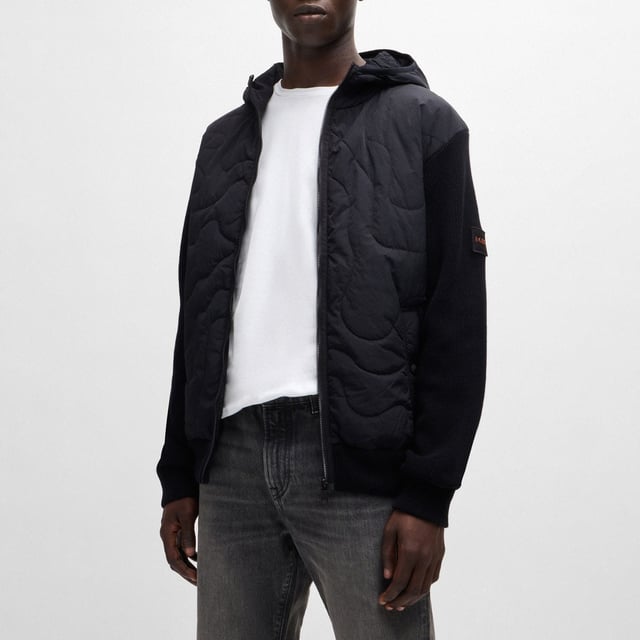 Mens BOSS Kalbero Relaxed Fit Padded Jacket in black.new seasonal design quilting on a light weight padded nylon - sleeves and back in half cardigan rib - double rib hem and cuffs with outside linking - front zip attached on top - visible press button with logo at pockets - squared logo at back inside - light weight padded hood with elasticated binding at opening - new herringbone logo patch at sleeve - 94% cotton 5% polyamide 1% elastane