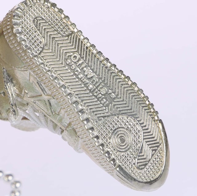 Accessories Off White Court 3.0 Sterling Necklace in Silver Off White Court 3.0 Sterling Necklace. This collection is a revival of Off-White’s iconic archive pieces, from the Jitney bag, the Cowboy boot and the arrows. The artist Gabriel Urist translated them into necklaces, pins, and keychain accessories. Each creation is defined by it’s metal-forming technique: a combination of hand-carved, machined, fabricated and computer generated parts. Material: 100% Sterling Silver. Ref: OMOB1220017200.